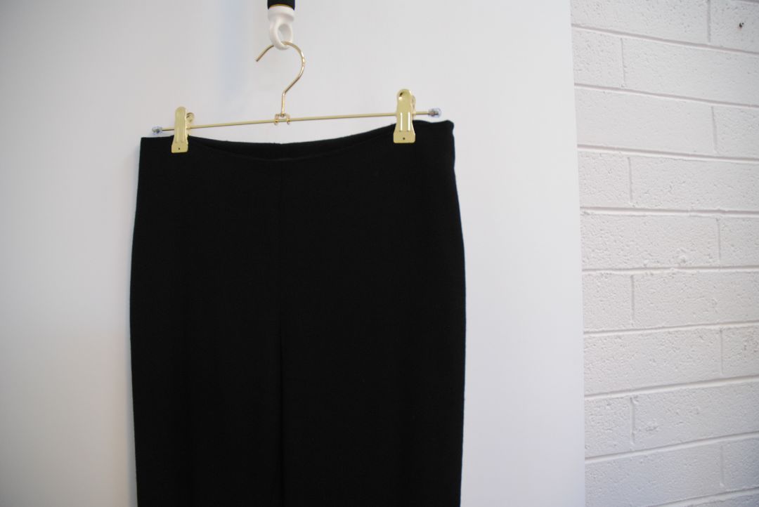 black The Row stretch knit pants, Waist (flat, unstretched): 13 in Rise: 11 in Inseam: 30 in Hip: 17 in Leg Opening: 7 in Fit: Slim leg, tapered Material: Midweight stretch knit (likely viscose-blend)