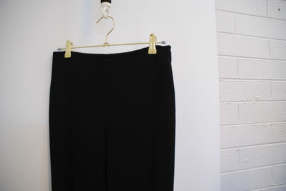 black The Row stretch knit pants, Waist (flat, unstretched): 13 in Rise: 11 in Inseam: 30 in Hip: 17 in Leg Opening: 7 in Fit: Slim leg, tapered Material: Midweight stretch knit (likely viscose-blend)