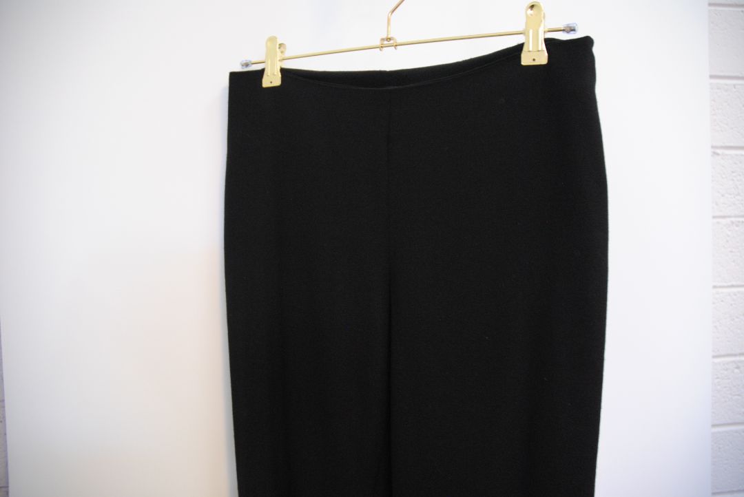 black The Row stretch knit pants, Waist (flat, unstretched): 13 in Rise: 11 in Inseam: 30 in Hip: 17 in Leg Opening: 7 in Fit: Slim leg, tapered Material: Midweight stretch knit (likely viscose-blend)