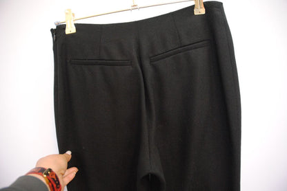 black The Row stretch knit pants, Waist (flat, unstretched): 13 in Rise: 11 in Inseam: 30 in Hip: 17 in Leg Opening: 7 in Fit: Slim leg, tapered Material: Midweight stretch knit (likely viscose-blend)