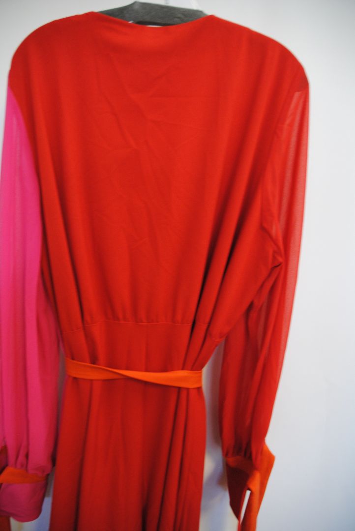 pink and red Marina Rinaldi Persona designer dress, Bust: 22.5 in (flat) Waist (adjustable tie): up to 21 in Hip: 24 in Length: 50 in (shoulder to hem) Sleeve Length: 24.5 in Fit: Relaxed wrap fit with tie belt