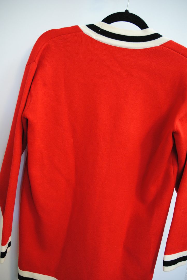 red Sandro knit cardigan, Bust (flat): 19.5 in Length (shoulder to hem): 27 in Sleeve Length: 21.5 in Shoulder to Shoulder: 17 in Fit: Relaxed, hip-length silhouette Closure: Button-down front