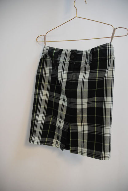 green and black Burberry plaid mini skirt, Dimensions (Approximate – Women’s Size S / 4 US)** Waist: 28 in Hip: 36 in Length: 19 in Slit Height: 2.5 in (front center) Closure: Triple-button front fly