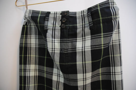 green and black Burberry plaid mini skirt, Dimensions (Approximate – Women’s Size S / 4 US)** Waist: 28 in Hip: 36 in Length: 19 in Slit Height: 2.5 in (front center) Closure: Triple-button front fly