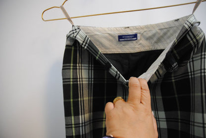 green and black Burberry plaid mini skirt, Dimensions (Approximate – Women’s Size S / 4 US)** Waist: 28 in Hip: 36 in Length: 19 in Slit Height: 2.5 in (front center) Closure: Triple-button front fly