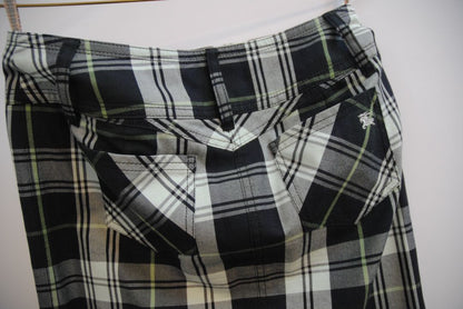 green and black Burberry plaid mini skirt, Dimensions (Approximate – Women’s Size S / 4 US)** Waist: 28 in Hip: 36 in Length: 19 in Slit Height: 2.5 in (front center) Closure: Triple-button front fly