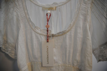 white Love Shack Fancy gwen pintuck dress, Bust: 34 in Waist: 28 in (elastic smocking in back) Length: 31 in (shoulder to hem) Sleeve Length: 10 in Fit: Flowy, relaxed fit with slight empire waist