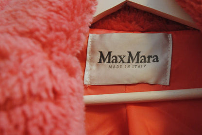 pink alpaca Max Mara Teddy bear icon coat, Length: Approx. 44 in Sleeve Length: Approx. 23 in Shoulder Width: Approx. 22 in Bust (pit to pit): Approx. 26 in Fit: Oversized cocoon silhouette