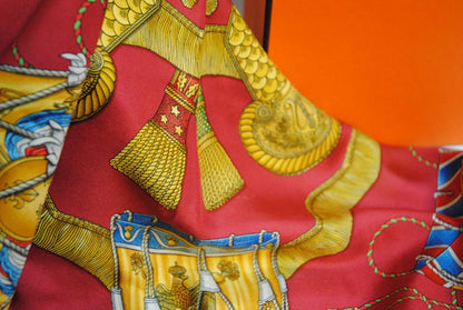 red and gold Hermes “Sous l’Égide de Mars” Silk Scarf (Vintage Red & Gold), Size: 90 cm x 90 cm (35.4” x 35.4”)