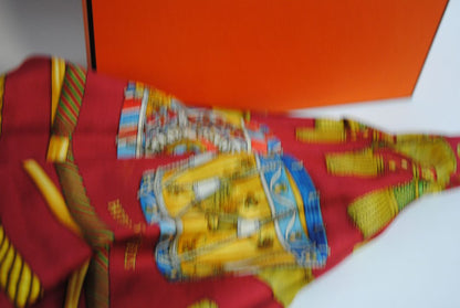 red and gold Hermes “Sous l’Égide de Mars” Silk Scarf (Vintage Red & Gold), Size: 90 cm x 90 cm (35.4” x 35.4”)
