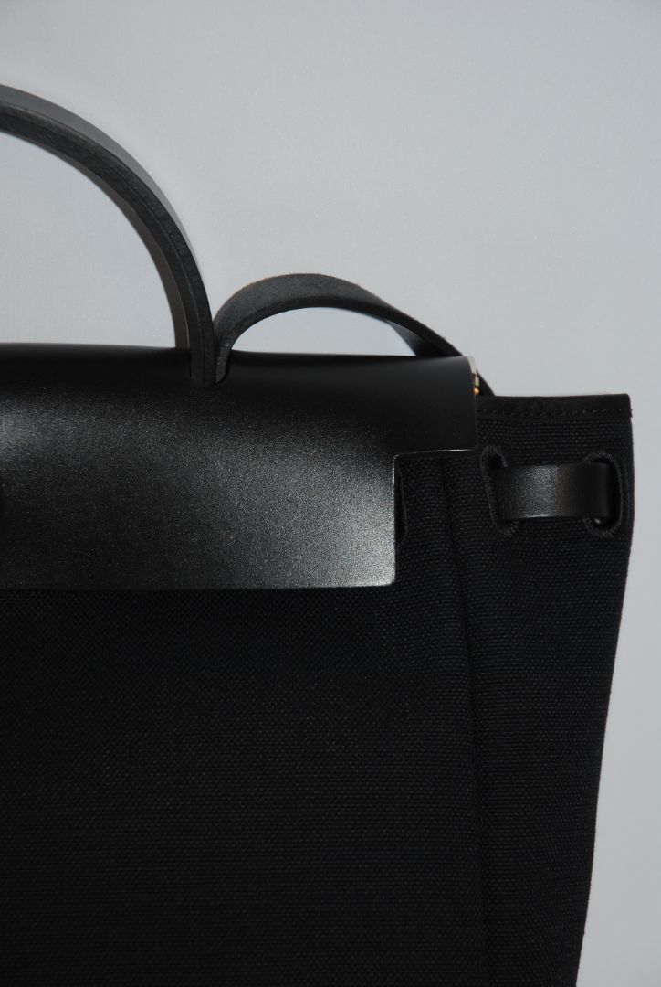 Black Canvas & Vache Hunter Leather with Palladium Hardware Hermes Hermès Herbag Zip 31 Retourne, Length: 12.25 in (31 cm) Height: 10 in (25 cm) Depth: 4.25 in (11 cm) Handle Drop: 2 in Strap Drop: Adjustable, up to 18 in (crossbody or shoulder)