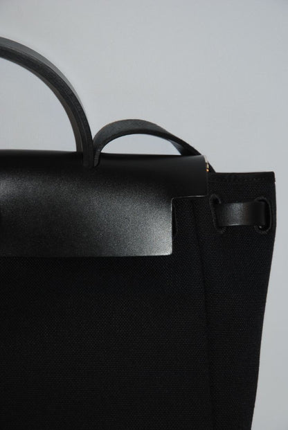 Black Canvas & Vache Hunter Leather with Palladium Hardware Hermes Hermès Herbag Zip 31 Retourne, Length: 12.25 in (31 cm) Height: 10 in (25 cm) Depth: 4.25 in (11 cm) Handle Drop: 2 in Strap Drop: Adjustable, up to 18 in (crossbody or shoulder)