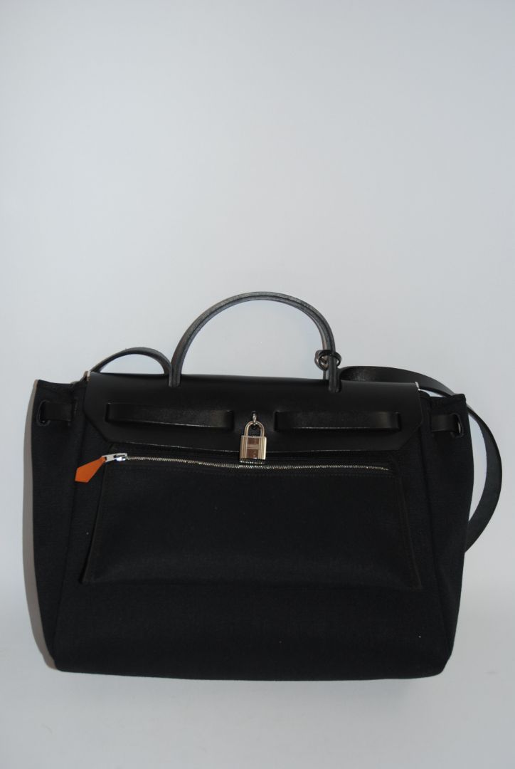 Black Canvas & Vache Hunter Leather with Palladium Hardware Hermes Hermès Herbag Zip 31 Retourne, Length: 12.25 in (31 cm) Height: 10 in (25 cm) Depth: 4.25 in (11 cm) Handle Drop: 2 in Strap Drop: Adjustable, up to 18 in (crossbody or shoulder)