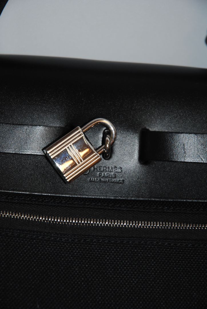 Black Canvas & Vache Hunter Leather with Palladium Hardware Hermes Hermès Herbag Zip 31 Retourne, Length: 12.25 in (31 cm) Height: 10 in (25 cm) Depth: 4.25 in (11 cm) Handle Drop: 2 in Strap Drop: Adjustable, up to 18 in (crossbody or shoulder)