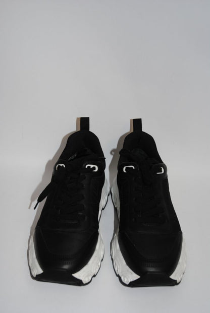 black and white Hermès Bouncing Sneaker, Heel Height: 1.5 in Platform: 1.25 in Fit: True to size (standard men’s sizing; this appears to be ~EU 41–43) Weight: Lightweight EVA sole (typical of Bouncing/Trail line)