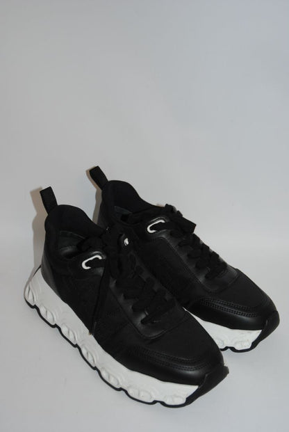 black and white Hermès Bouncing Sneaker, Heel Height: 1.5 in Platform: 1.25 in Fit: True to size (standard men’s sizing; this appears to be ~EU 41–43) Weight: Lightweight EVA sole (typical of Bouncing/Trail line)