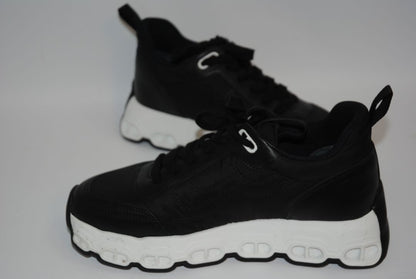 black and white Hermès Bouncing Sneaker, Heel Height: 1.5 in Platform: 1.25 in Fit: True to size (standard men’s sizing; this appears to be ~EU 41–43) Weight: Lightweight EVA sole (typical of Bouncing/Trail line)