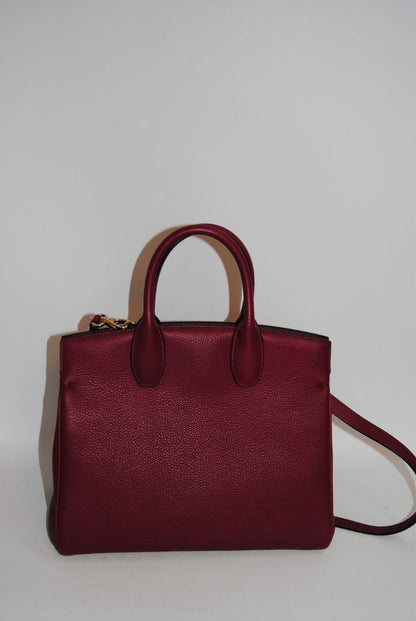 deep raspberry Salvatore Ferragamo Gancini top handle cross body, Length: 10.5 in Height: 8.25 in Depth: 5 in Top Handle Drop: 4 in Strap Drop: Adjustable, approx. 18–22 in