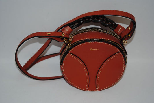 rich cognac brown Chloe Designer bag, Approx. 7” W x 7” H x 2.5” D Strap Drop: 20” adjustable crossbody strap