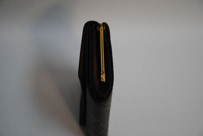 monogram Louis Vuitton canvas wallet, Approx. 4.3” W x 3.5” H x 1” D Compact bi-fold silhouette