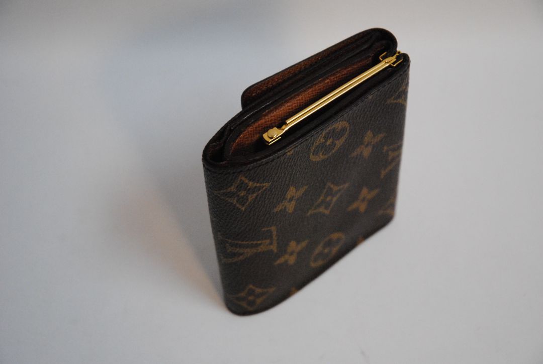 monogram Louis Vuitton canvas wallet, Approx. 4.3” W x 3.5” H x 1” D Compact bi-fold silhouette
