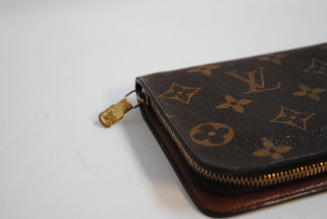 brown monogram Louis Vuitton Zippy Monogram Wallet, Approx. 7.7” W x 4.1” H x 1” D Long continental-style silhouette