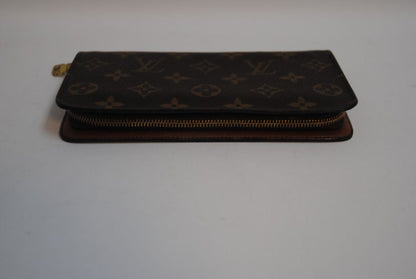 brown monogram Louis Vuitton Zippy Monogram Wallet, Approx. 7.7” W x 4.1” H x 1” D Long continental-style silhouette