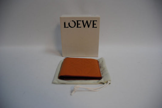 mustard yellow Loewe Embossed anagram bifold wallet, Length: 4.3 in (11 cm) Height: 3.5 in (9 cm) Depth: 0.6 in (1.5 cm)