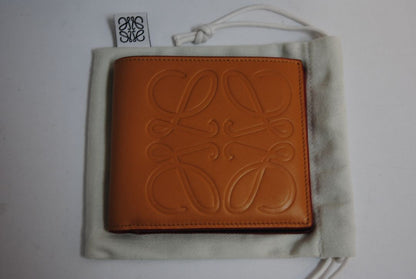 mustard yellow Loewe Embossed anagram bifold wallet, Length: 4.3 in (11 cm) Height: 3.5 in (9 cm) Depth: 0.6 in (1.5 cm)
