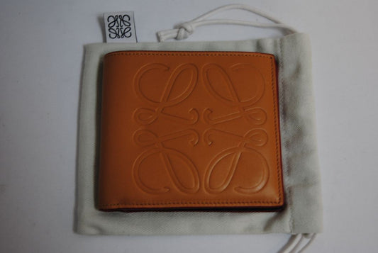 mustard yellow Loewe Embossed anagram bifold wallet, Length: 4.3 in (11 cm) Height: 3.5 in (9 cm) Depth: 0.6 in (1.5 cm)