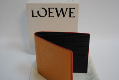 mustard yellow Loewe Embossed anagram bifold wallet, Length: 4.3 in (11 cm) Height: 3.5 in (9 cm) Depth: 0.6 in (1.5 cm)