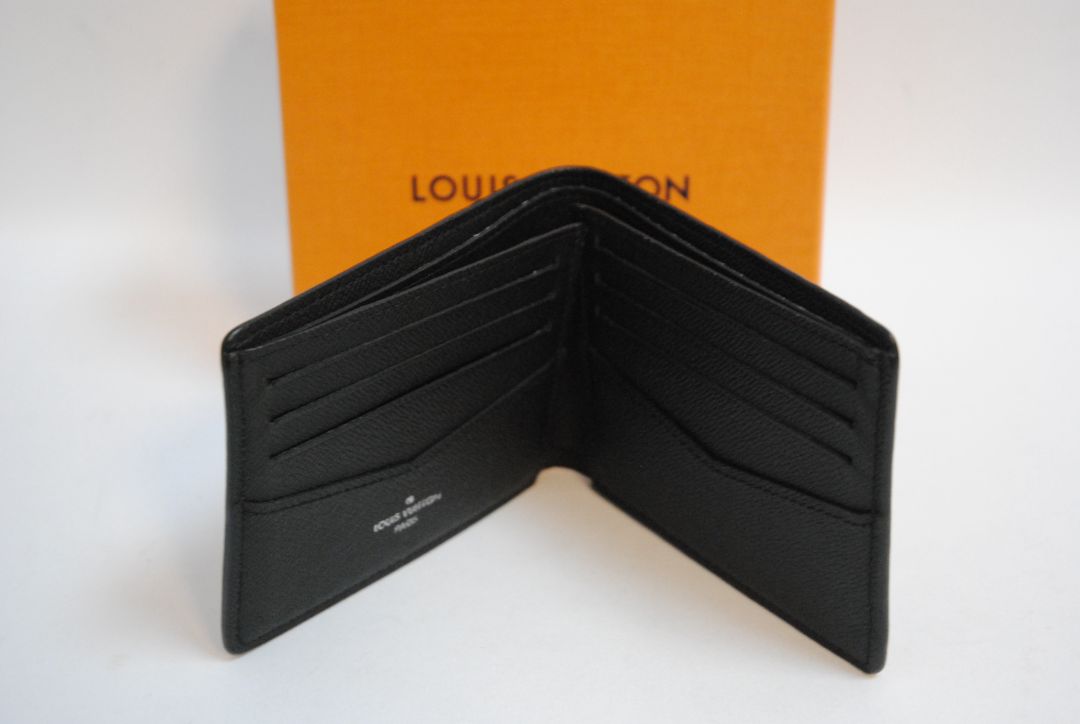 Exterior: Monogram Eclipse canvas (black with dark grey monogram pattern) Interior: Black leather Louis Vuitton Multiple Wallet in Monogram Eclipse Canvas, Length: 4.5 in (11.5 cm) Height: 3.5 in (9 cm) Depth: 0.6 in (1.5 cm)