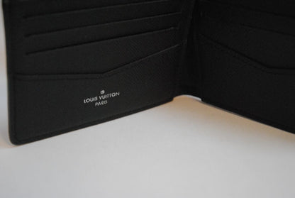 Exterior: Monogram Eclipse canvas (black with dark grey monogram pattern) Interior: Black leather Louis Vuitton Multiple Wallet in Monogram Eclipse Canvas, Length: 4.5 in (11.5 cm) Height: 3.5 in (9 cm) Depth: 0.6 in (1.5 cm)