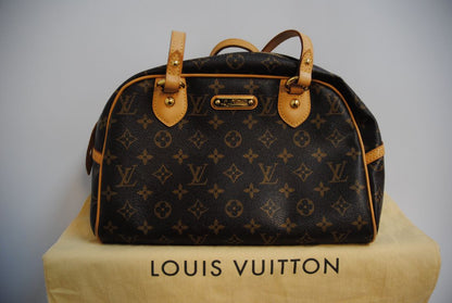 monogram canvas Louis Vuitton Tivoli PM monogram canvas satchel, Length: 14.2 in (36 cm) at widest point Height: 8.3 in (21 cm) Depth: 6.7 in (17 cm) Handle Drop: 6 in (15 cm)