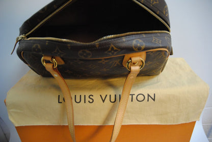 monogram canvas Louis Vuitton Tivoli PM monogram canvas satchel, Length: 14.2 in (36 cm) at widest point Height: 8.3 in (21 cm) Depth: 6.7 in (17 cm) Handle Drop: 6 in (15 cm)