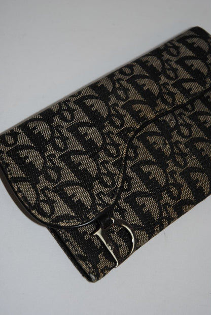 black and grey Christian Dior OBLIQUE TROTTER LONG WALLET, Dimensions: Approx. 7.5” L × 4.25” H × 1” D