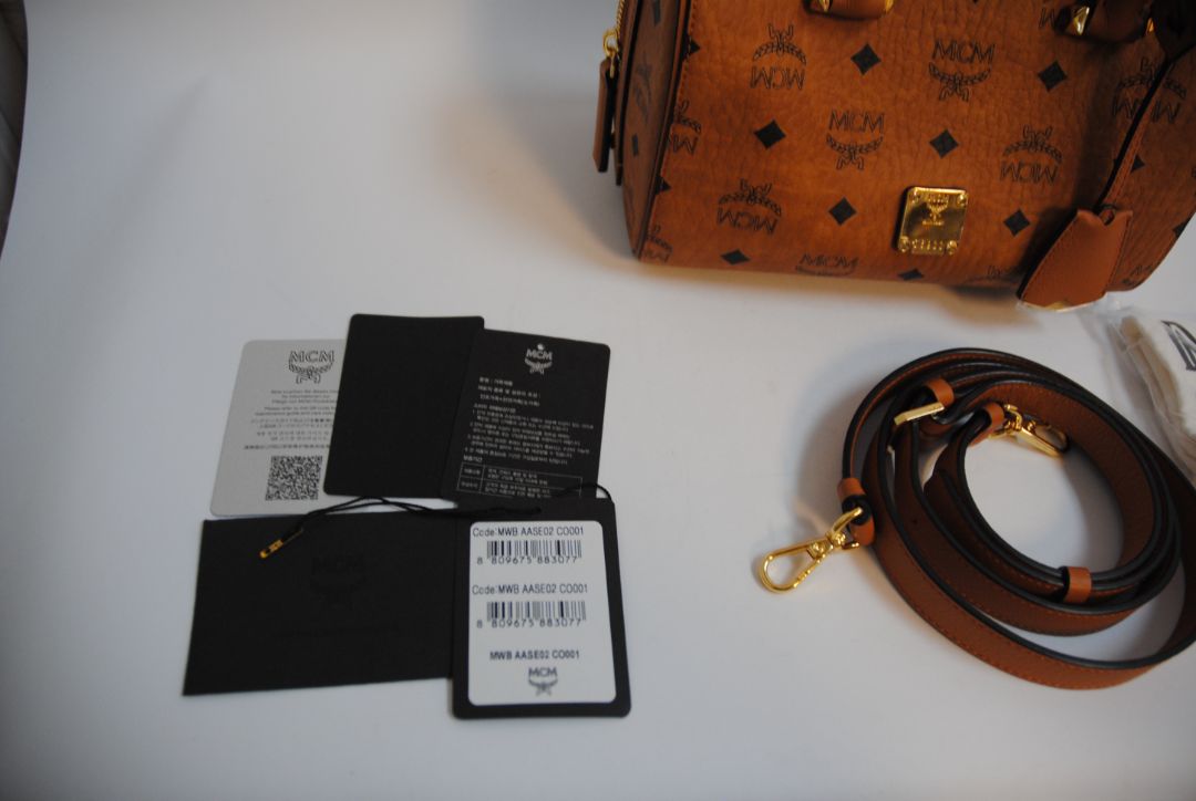 cognac MCM Essential Boston Bag – Medium, Length: 11.8 in (30 cm) Height: 7.5 in (19 cm) Depth: 6.7 in (17 cm) Handle Drop: 4 in (10 cm) Strap Drop: Adjustable up to 22 in (crossbody)