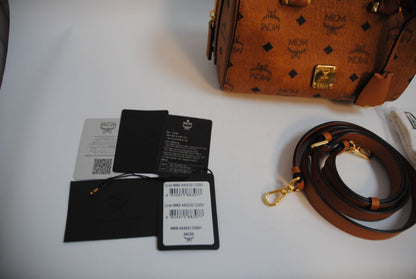 cognac MCM Essential Boston Bag – Medium, Length: 11.8 in (30 cm) Height: 7.5 in (19 cm) Depth: 6.7 in (17 cm) Handle Drop: 4 in (10 cm) Strap Drop: Adjustable up to 22 in (crossbody)