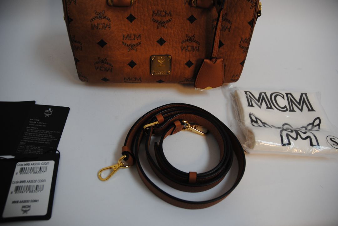 cognac MCM Essential Boston Bag – Medium, Length: 11.8 in (30 cm) Height: 7.5 in (19 cm) Depth: 6.7 in (17 cm) Handle Drop: 4 in (10 cm) Strap Drop: Adjustable up to 22 in (crossbody)