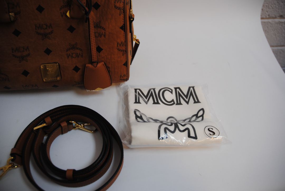 cognac MCM Essential Boston Bag – Medium, Length: 11.8 in (30 cm) Height: 7.5 in (19 cm) Depth: 6.7 in (17 cm) Handle Drop: 4 in (10 cm) Strap Drop: Adjustable up to 22 in (crossbody)