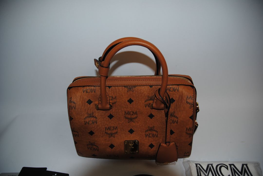 cognac MCM Essential Boston Bag – Medium, Length: 11.8 in (30 cm) Height: 7.5 in (19 cm) Depth: 6.7 in (17 cm) Handle Drop: 4 in (10 cm) Strap Drop: Adjustable up to 22 in (crossbody)