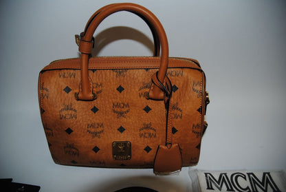 cognac MCM Essential Boston Bag – Medium, Length: 11.8 in (30 cm) Height: 7.5 in (19 cm) Depth: 6.7 in (17 cm) Handle Drop: 4 in (10 cm) Strap Drop: Adjustable up to 22 in (crossbody)