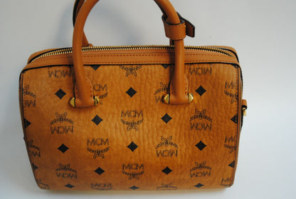 cognac MCM Essential Boston Bag – Medium, Length: 11.8 in (30 cm) Height: 7.5 in (19 cm) Depth: 6.7 in (17 cm) Handle Drop: 4 in (10 cm) Strap Drop: Adjustable up to 22 in (crossbody)