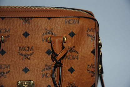 cognac MCM Essential Boston Bag – Medium, Length: 11.8 in (30 cm) Height: 7.5 in (19 cm) Depth: 6.7 in (17 cm) Handle Drop: 4 in (10 cm) Strap Drop: Adjustable up to 22 in (crossbody)
