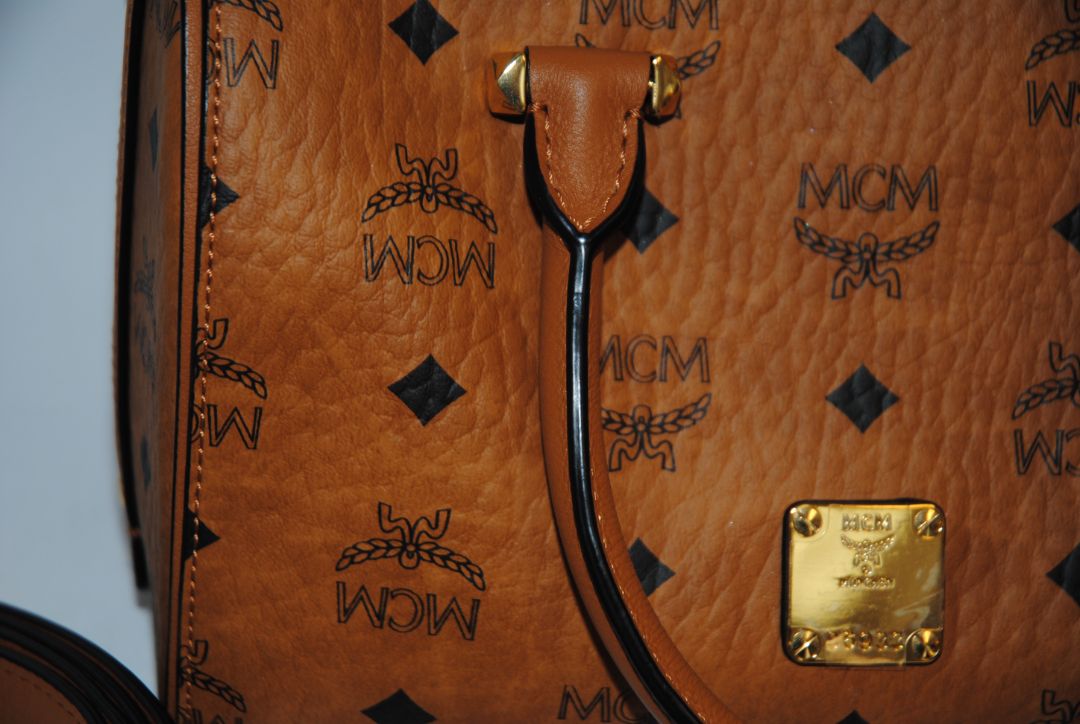 cognac MCM Essential Boston Bag – Medium, Length: 11.8 in (30 cm) Height: 7.5 in (19 cm) Depth: 6.7 in (17 cm) Handle Drop: 4 in (10 cm) Strap Drop: Adjustable up to 22 in (crossbody)