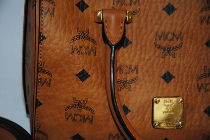 cognac MCM Essential Boston Bag – Medium, Length: 11.8 in (30 cm) Height: 7.5 in (19 cm) Depth: 6.7 in (17 cm) Handle Drop: 4 in (10 cm) Strap Drop: Adjustable up to 22 in (crossbody)