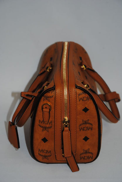 cognac MCM Essential Boston Bag – Medium, Length: 11.8 in (30 cm) Height: 7.5 in (19 cm) Depth: 6.7 in (17 cm) Handle Drop: 4 in (10 cm) Strap Drop: Adjustable up to 22 in (crossbody)