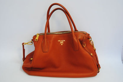 Burnt Orange / Papaya Prada Vitello Daino Zip Tote with Shoulder Strap, Length: 13.5 in (34 cm) Height: 10.5 in (27 cm) Depth: 6.5 in (17 cm) Handle Drop: 7.5 in (19 cm) Strap Drop: Up to 22 in adjustable