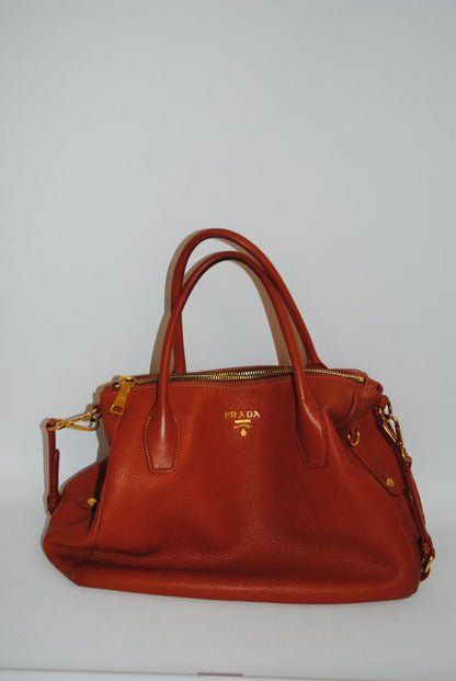 Burnt Orange / Papaya Prada Vitello Daino Zip Tote with Shoulder Strap, Length: 13.5 in (34 cm) Height: 10.5 in (27 cm) Depth: 6.5 in (17 cm) Handle Drop: 7.5 in (19 cm) Strap Drop: Up to 22 in adjustable