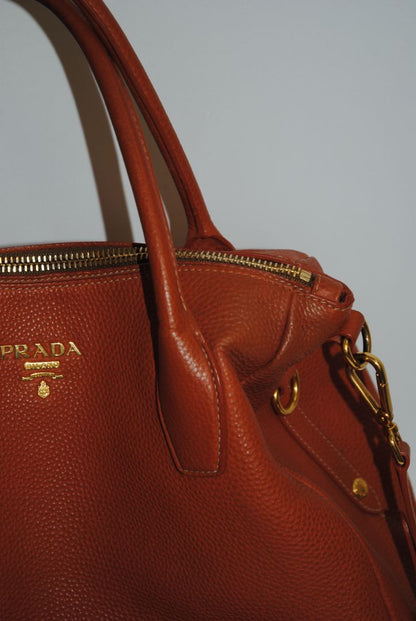 Burnt Orange / Papaya Prada Vitello Daino Zip Tote with Shoulder Strap, Length: 13.5 in (34 cm) Height: 10.5 in (27 cm) Depth: 6.5 in (17 cm) Handle Drop: 7.5 in (19 cm) Strap Drop: Up to 22 in adjustable